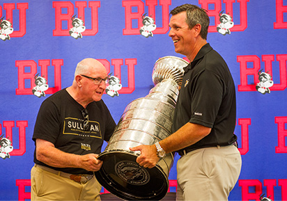 Mike Sullivan holding Stanley Cup with father at BU