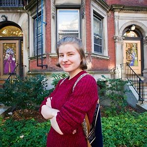 Daria Lugina in front of painted doors