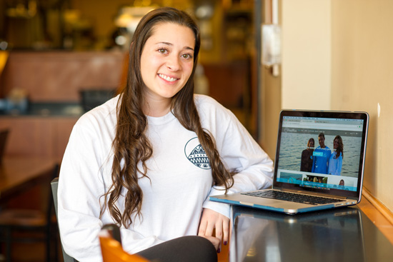 Alexa Pisano showing her online store on a laptop