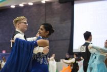 Luke Jones (left) and Ballroom Dance Club president Nikita Varman competing in the rhythm category at the 2017 Terrier Dancesport competition in the Metcalf Ballroom February 19.