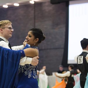 Luke Jones (left) and Ballroom Dance Club president Nikita Varman competing in the rhythm category at the 2017 Terrier Dancesport competition in the Metcalf Ballroom February 19.