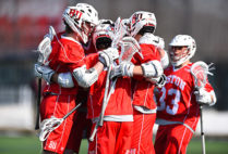 BU men's lacrosse team huddle