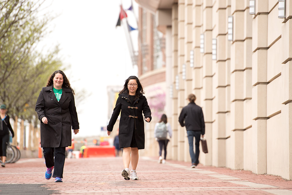 During lunchtime, and Marketing & Communications copy editor Rachel Johnson (left) and External Affairs administrative manager Takyu Tang log steps during their lunch break.