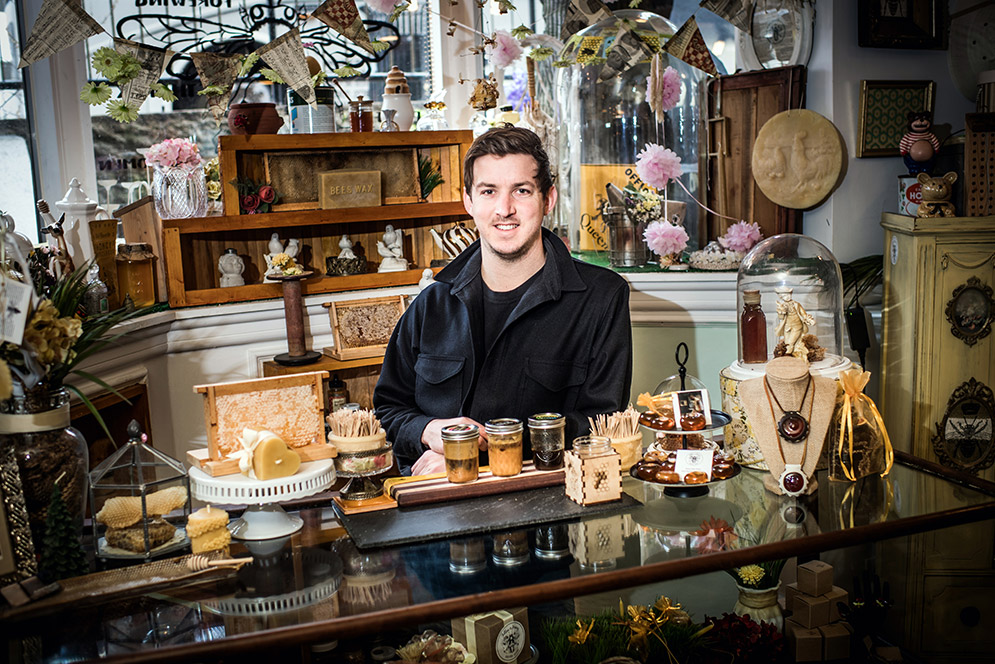 Questrom grad student Brian Woerner is equally at home offering a tasting at Follow The Honey in Cambridge or working with locals in Tanzania to help produce a sustainable supply of organic honey