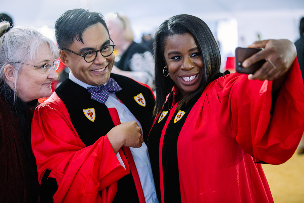 <em>Orange is the New Black</em> cast member Uzo Aduba takes a photo with students at the Boston University College of Fine Arts convocation, part of the 144th BU Commencement