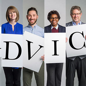 Boston University faculty and staff hold placards with letters spelling ADVICE symbolizing Advice for graduating seniors of the Class of 2017