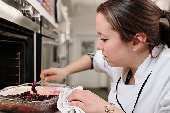 A cook prepares a recipe at America's Test Kitchen