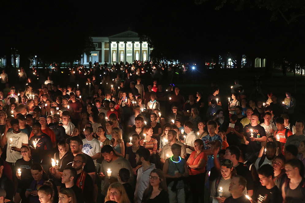 Hundreds gathered on the University of Virginia campus for a candlelight vigil against hate and violence days after Charlottesville erupted in chaos during the "Unite the Right" white nationalist rally.