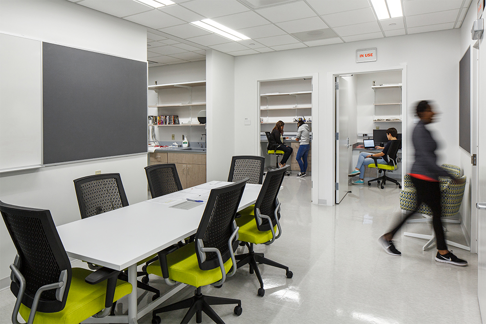 Team meeting room collaboration space at the Center for Research in Sensory Communication & Emerging Neural Technology lab (CRESCENT lab) at the Rajen Kilachand Center for Integrated Life Sciences and Engineering science building at Boston University, which is designed to encourage collaborative research and interdisciplinary science