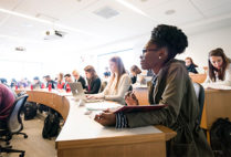 Students follow along during a class at the Boston University School of Law