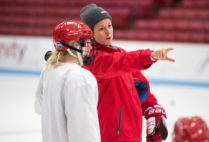 BU Ice Hockey Coach Tara Watchorn instructs a player during practice.