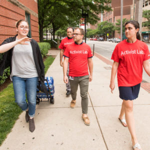 BUSPH Water Squad volunteers walk to a location where they will handout water
