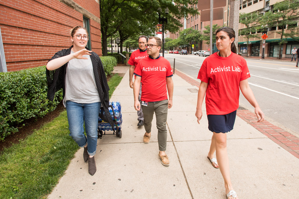 BUSPH Water Squad volunteers walk to a location where they will handout water