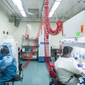 Infectious disease researchers Elke Mühlberger (left) and Adam Hume conduct BSL-4 research at Boston University's National Emerging Infectious Diseases Laboratories (NEIDL).