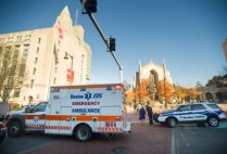 A BU police vehicle is parked in front of Marsh Chapel on a beautiful fall day.