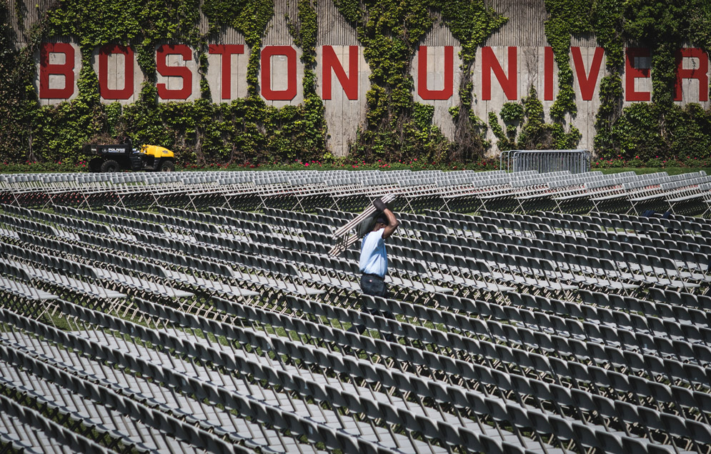 May 16: Facilities workers, like Taye Abebe, have a massive job readying Nickerson Field for Commencement each year, but they always get it done. Photo by Jackie Ricciardi