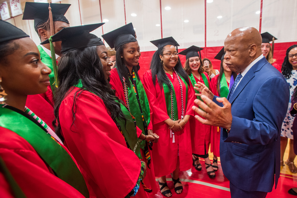 2018 Commencement speaker US Rep. John Lewis (Hon.’18) (D-Ga.) with Posse graduates from his home state: Demeisha Crowley (CGS’16, Sargent’18) (from left), Bukola Alli (Sargent’18), Devaughn Bennett (Questrom’18), Jordan Fessehaie (SHA’18), India Smith (CAS’18), Jenna Perlman (COM’18), Mae Davis (COM’18), and Claire Lenz (Questrom’18). Photo by Cydney Scott