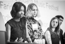 BU entrepreneurs Ellice Patterson, Dielle Lundberg, and Inês Andrade answer questions at the podium during the IDEA 2019 conference.