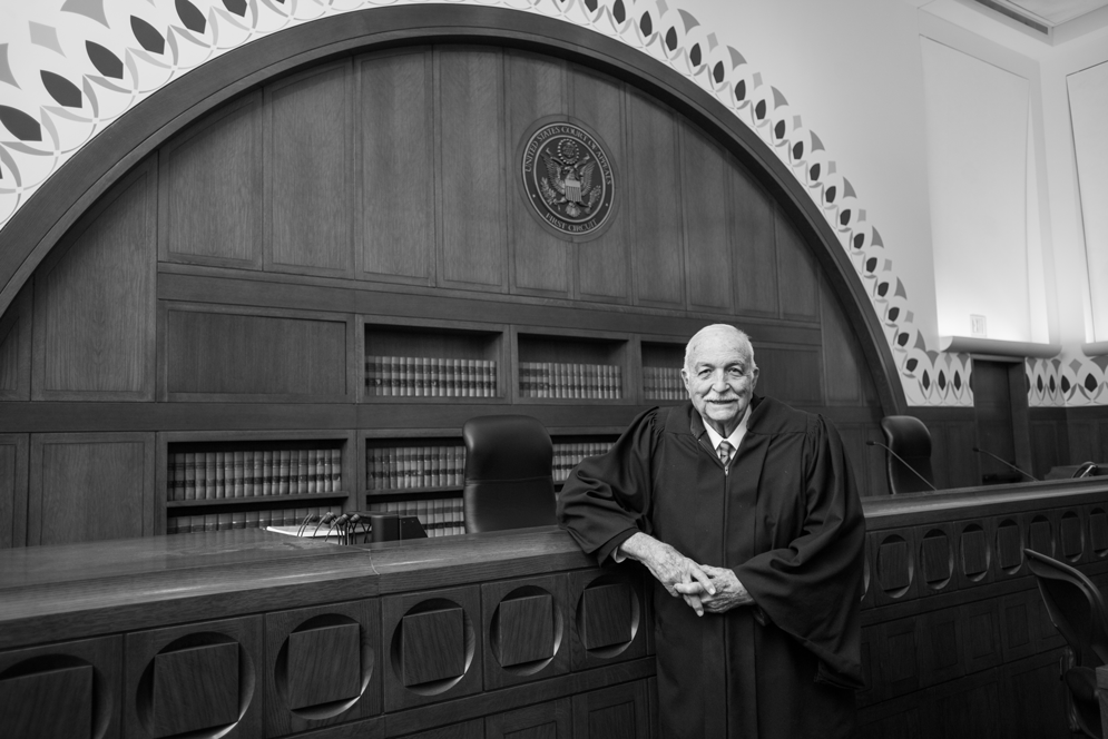 Judge Juan Torruella posing in the courtroom