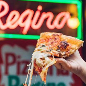 A cheesy slice of pizza from Regina Pizzeria