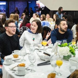 Students talk and laugh at the BU senior breakfast in Metcalf Hall, May 3, 2019.