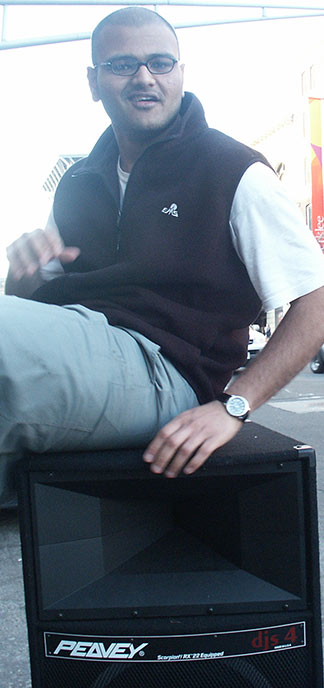 Rahul Desikan poses for a photo sitting on a Peavey speaker outside of Berklee College of Music in 2003.