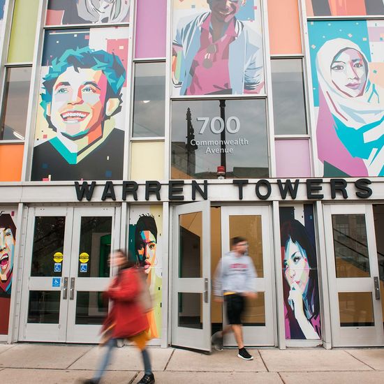 students walking in front of warren towers