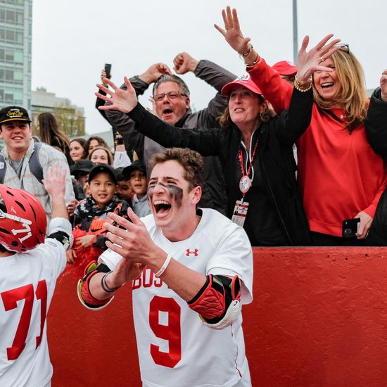 Tommy Jepson (CAS’24) (#9) and his family and friends celebrate BU’s win over Lehigh during the Patriot League men’s lacrosse semifinals