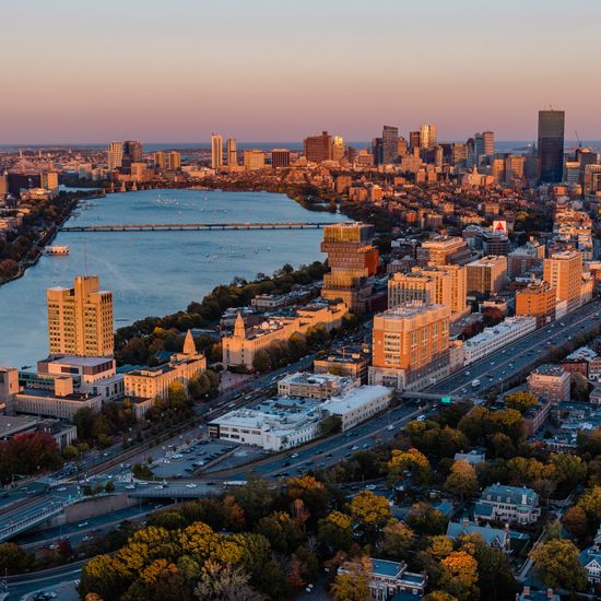 Aerial photo of Boston University along Commonwealth Avenue, the Boston skyline, Cambridge, and the Charles River