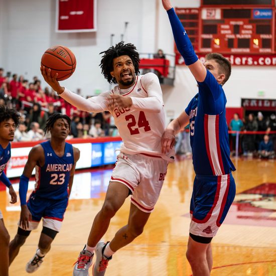Miles Brewster (CAS’24) goes in for a lay-up against American University at the Case Gym
