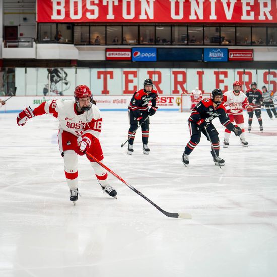 Neely Nicholson (Questrom’27), skating for BU women’s hockey, heads toward the goal during a game against Northeastern