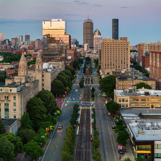 Commonwealth Avenue, with the College of Arts & Sciences and the Duan Family Center for Computing & Data Sciences on the left and Warren Towers on the right at dusk