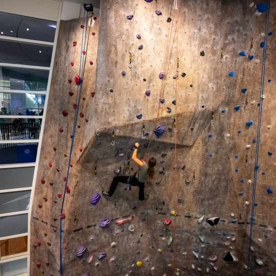 Sierra Koerber-Marx (CAS’26) scales the climbing wall with seeming ease during the BU Fitness & Recreation Center’s Women and Nonbinary Climb Night