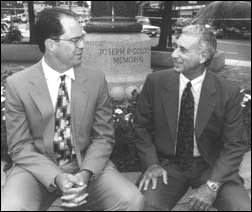 Hello and goodbye: Boston University's new community relations director, Joe Walsh (left), chats with his predecessor, Joe Amorosino. Photo: Vernon Doucette 