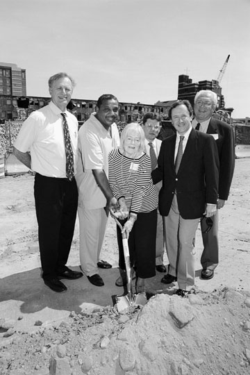 On August 17, a groundbreaking ceremony was held for BU's new athletic training complex, which will be in the future Agganis Center, the sports and recreation building in the John Hancock Student Village project.  Pictured at the ceremony are (from left) David Walko (CAS'68), associate director of development for athletics, former BU football player Peter Kessel (SED'76), Lucille Dougal, former BU student athletic trainers Kenneth Gould (CAS'73, GRS'85) and Chris Pilalas (SMG'75), and Gary Strickler, athletics director. After Gould presented Lucille Dougal with a plaque commemorating the groundbreaking, she gave Pilalas her husband's 1971 BU hockey NCAA championship ring, which will be displayed at the complex. Photo by Albert L'Étoile