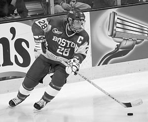 Terrier fans and teammates anxiously await the return of Freddy Meyer (MET’03), who scored the game-winning goal in BU’s 2-1 victory over Harvard in this year’s Beanpot tournament opener. Photo by Rob Klein.