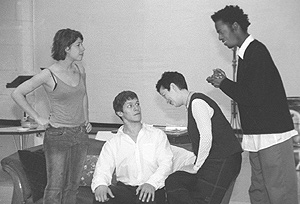 During a rehearsal of Hay Fever, guests of the Blisses, played by (left to right) Mehera Blum (CFA’03), Paul Cortez (CFA’03), Jane Bergeron (CFA’03), and Baron Vaughn (CFA’03), plot their escape from the family’s country estate. Photo by Michael Hamilton