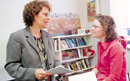 Patricia Johnson talks with graduate Molly Ann Connors (CAS'03), whose majors were ancient Greek and Latin and classical studies. Photo by Kalman Zabarsky