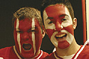 Midnight maniacs: Joe Rouse (CAS07) (left) and Tim Knauf (CAS07) were among more than 1,000 fans at Walter Brown Arena for the mens hockey teams first official practice of the season, at 12:01 a.m. on October 2  an annual spectacle known as Midnight Mania. Photo by Phoebe Sexton (COM06)