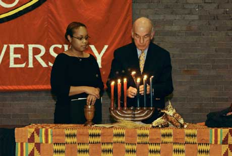 President ad interim Aram Chobanian and Zania Saul (SED05) at a December 2 ceremony at the George Sherman Student Union celebrating Kwanza. 