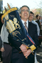 Carrying Torahs in a procession to the new Florence and Chafetz Hillel House May 12 are Avi Heller (UNI97), Bruce Ginsburg (CAS73), and Randi Kaplan, Orthodox, Conservative, and Reform rabbis, respectively. The Torahs were placed in the buildings three separate chapels. Photo by BU Photo Services