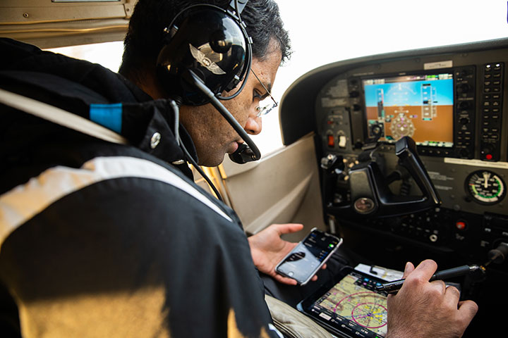 Dharmesh Tarapore checking information during his flight