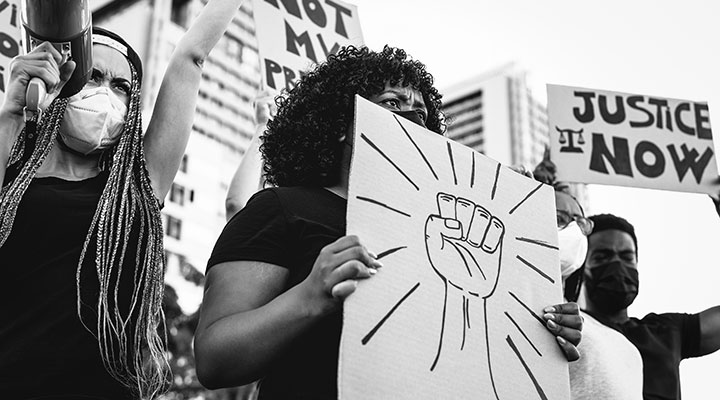 Participants holding signs at a Black Lives Matter protest