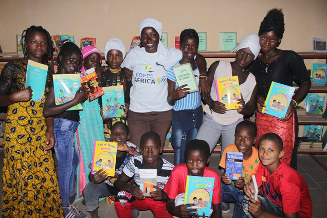 A group of people holding up library books