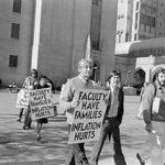 Faculty marching on Marsh Plaza including Howard Zinn, whose sign reads "Faculty have families. Inflation hurts."