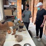 Daniela Hernández Sariñana (GRS‘23,’23) shows Mark Mobius (above right) a lab during his tour of David Carballo’s excavation in Mexico.