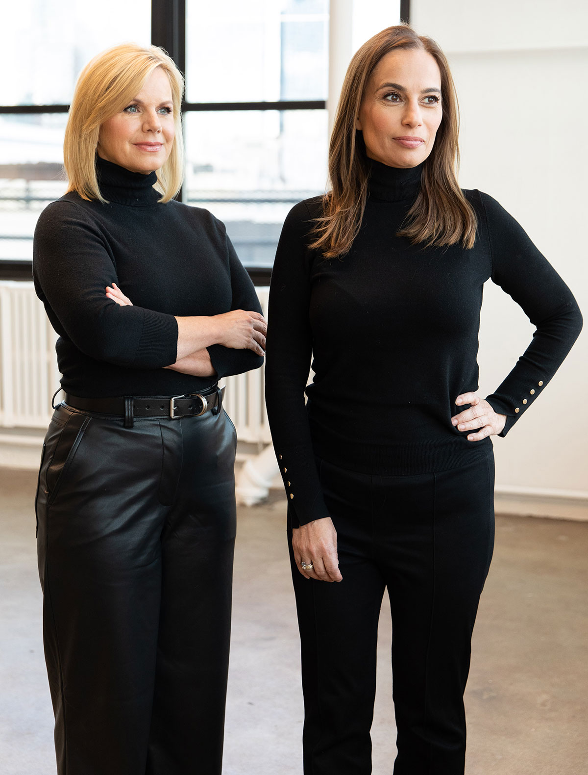 Gretchen Carlson & Julie Roginsky standing side by side in an office setting