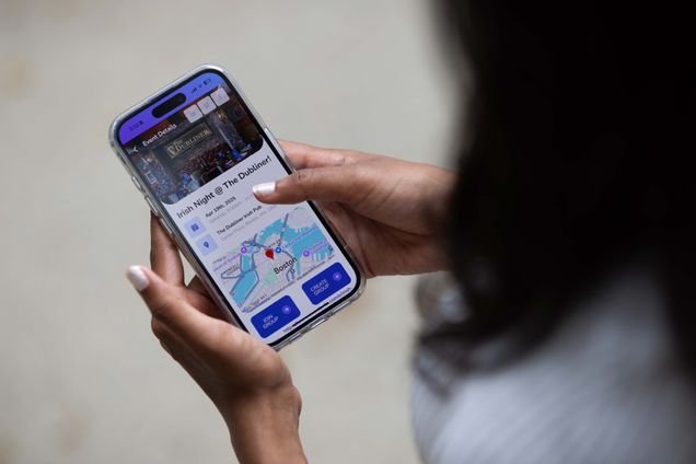 Student looking app on their phone.