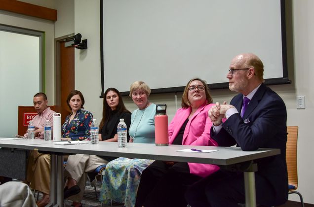 Panelists look to Steve Parnell as he speaks