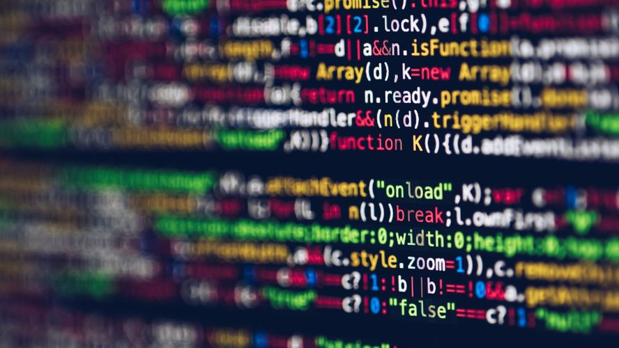 Photo of computer screen with multi-colored code